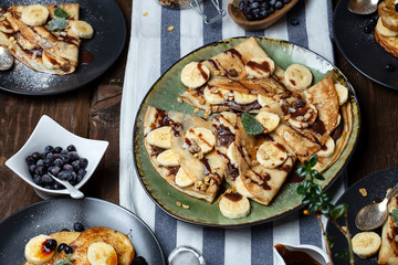 crepes with banana, chocolate-nut sauce and sweet croutons