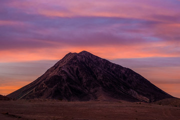 Mountain in Nevada desert at late sunset