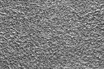 Background texture of crumpled  aluminum leaf foil.