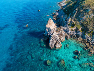 Aerial view of Tropea beach, crystal clear water and rocks that appear on the beach. Rock Pizzuta. Calabria, Italy