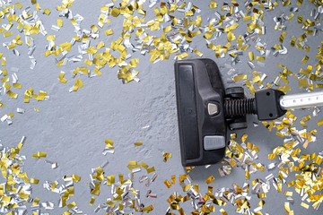 vacuuming confetti and copying space for text 