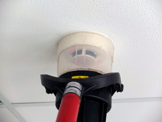 Narva, Estonia  03.04.2019 , Office room . Fire alarm system service. Professional Smoke Detector Tester 