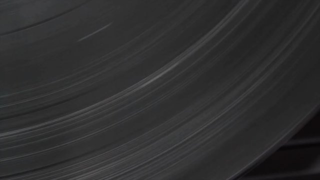 Close up of vinyl record on DJ turntable record player