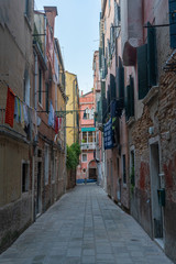Old street in Venice with outdoor laundry. Travel photo. Italy. Europe