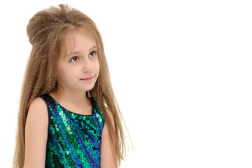 Little girl is sitting on the floor.