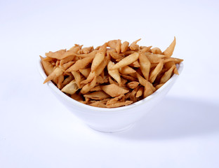 Shakkar pare Also Know as Shakkarpare, Shakarpare, Shakarpali, Shakkar Para, Sakarpara or Shankarpalli or shankar pale is a Snack Typically Made in India During Diwali - Image