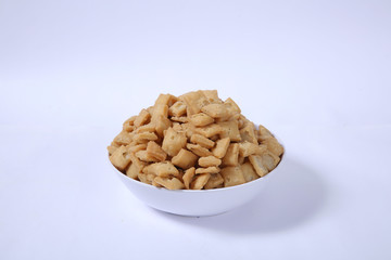 Shakkar pare Also Know as Shakkarpare, Shakarpare, Shakarpali, Shakkar Para, Sakarpara or Shankarpalli or shankar pale is a Snack Typically Made in India During Diwali - Image