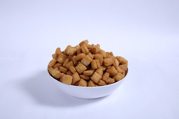 Shakkar pare Also Know as Shakkarpare, Shakarpare, Shakarpali, Shakkar Para, Sakarpara or Shankarpalli or shankar pale is a Snack Typically Made in India During Diwali - Image