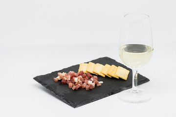 Taco of ham and white wine or sweet wine in glass vase. Tempranillo grape variety and Cabernet...