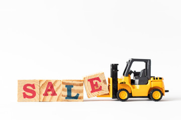 Toy forklift hold wood letter block e to complete word sale on white background