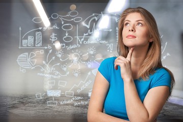 Businesswoman with financial symbols coming from her hand