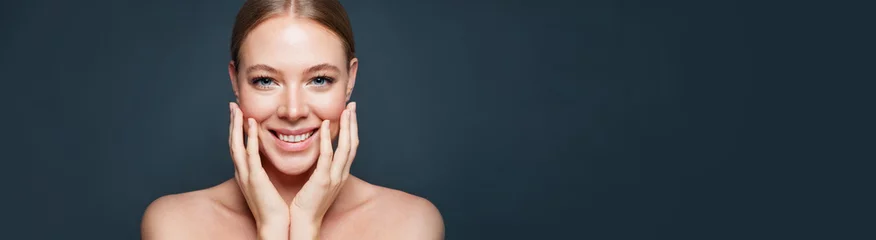 Beautiful woman face close up portrait. Healthy model on blue banner background. Natural beauty