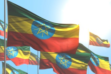 beautiful independence day flag 3d illustration. - many Ethiopia flags are wave against blue sky illustration with bokeh