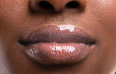 Perfect plump lips of black woman after filler injections - obrazy, fototapety, plakaty