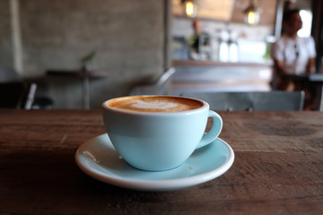 cup of coffee on table in cafe - vintage style effect picture