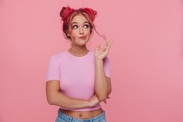 Portrait of glamorous woman thinking and standing with arms crossed