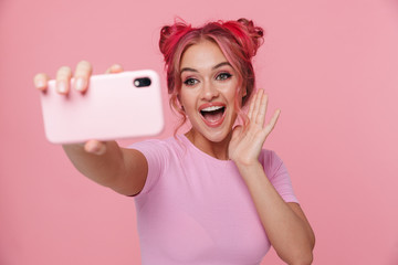 Portrait of gorgeous young woman taking selfie photo on cellphone