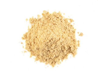 Small pile of ground mustard isolated on white background with copy space for text, images. Spices and herbs. Packaging concept. Close-up, top view.