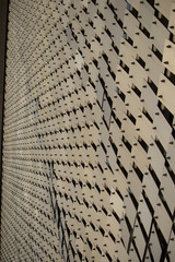 Yellow metal plates on movable hinges as a background