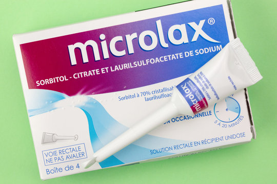 Closeup on Microlax box with its cannula on green background