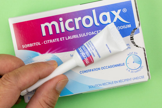 Closeup on Microlax box with its cannula holding in hand