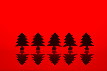 Merry christmas and Happy new year holiday red background. Happy holidays banner, decorative spruce