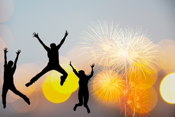 Silhouette happy business teamwork jumping and cheering crowd fireworks congratulation graduation in Happy New year 2020. Freedom lifestyle group people jump as part of Number 2020 at the sunset