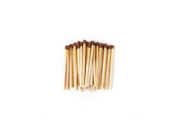 a small pile of matches on a white background top view