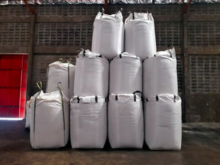 Chemical fertilizer Urea Stock pile jumbo-bag in warehouse waiting for shipment.