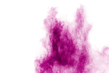 Explosion of pink colored powder isolated on white background.Pink dust splash.