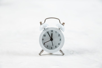 Retro alarm clock on white background.