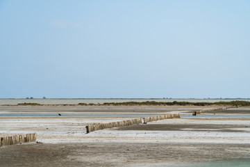 The dry soil of an old salt sea under the blue sky