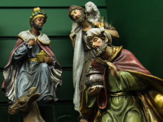 Christmas Manger scene with figurines, selective focus at Jesus.