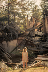A woman looks at a blockage from the building.