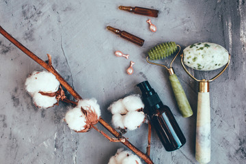 Dermaroller and serum next to an anti aging face cream Beauty industry Close-up Dermaroller for...