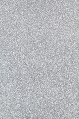Silver coloured sparkling festive background, close-up. Copy space for text. Vertical. Celebration, holidays, sales, fashion concept, harvesting for mock up