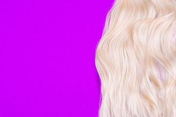 Hair color blond on a bright purple background. Hair and beauty salon. Beauty concept. Hair Colors Palette. Hair Texture