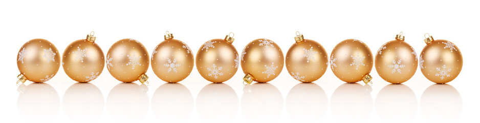 Golden Christmas ornaments in a row on white background with reflection