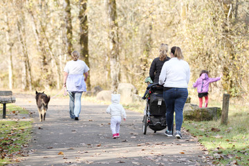 People outside enjoying the park on a nice sunny day.