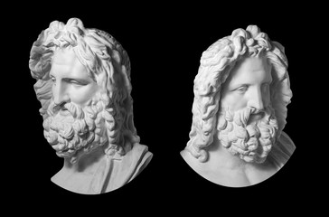 Two gypsum copy of antique statue Zeus head isolated on black background. Plaster sculpture man...