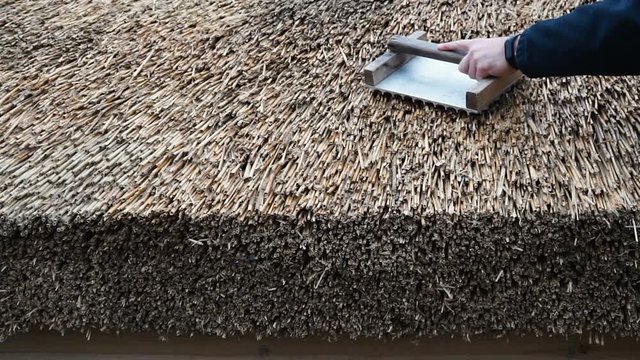 The thatch roofing, reed roof on the house. Natural building materials.