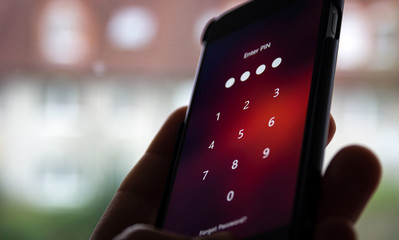 Enter the PIN code on the phone. Information Security Concept.