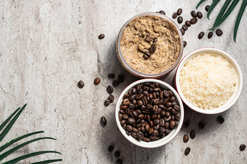 Ingredients for natural homemade coffee scrub on dark marble table with copy space for your text. Skin care concept.