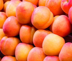Fresh juicy peaches at a market stand in Europe