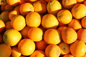 Box with oranges at sunrise