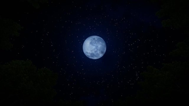 Looking up to a full moon with time lapse clouds against starry sky, zoom in 4K