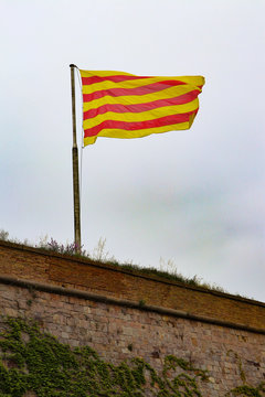 Flag of Catalonia - The Senyera contains the  bars of Aragon,  which represented the King of the Crown of Aragon.