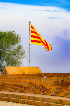 Flag of Catalonia - The Senyera contains the  bars of Aragon,  which represented the King of the Crown of Aragon.