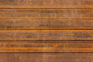 Rusty old background made of thick and narrow details. Iron corrosion