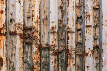Rusty old background made of thick and narrow details. Corrosion of profile iron.